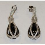 A pair of diamond and black stone balloon drop earrings,