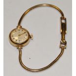 A 9ct gold Cyma lady's wristwatch with snake link bracelet, champagne dial,