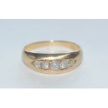 A diamond quintet ring, linear set with five old cushion and free form diamonds,