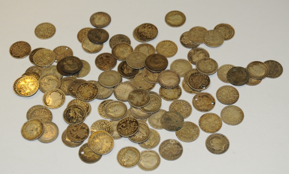 Coins - a quantity of pre-decimal silver threepenny bits,