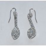 A pair of diamond drop earrings, each with a navette principle stone approx 0.