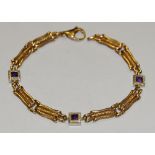 A 9ct gold bracelet set with square cut amethysts