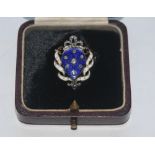 A diamond and enamel shield brooch,