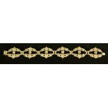 An Art Deco style diamond bracelet, with six open arched pave diamond encrusted panels,