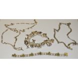 A silver charm bracelet with 19 charms;