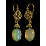 A pair of foil back opal and diamond drop earrings,