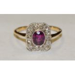 An Art Deco diamond and ruby cluster ring, central oval vibrant purply red ruby approx 0.