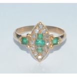 An Edwardian emerald and diamond navette cluster ring,