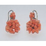A pair of coral bead and free form floral cluster drop earrings,