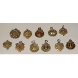 Early 20th century silver fobs- gymnastics, darts, B.C.C.A, etc..