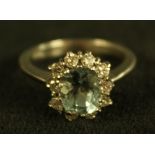A blue topaz, diamond and white stone cluster ring,