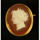 A late 19th century carved agate cameo portrait brooch, neoclassical maiden facing right,