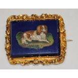 An Victorian micro mosaic & lapis lazuli brooch depicting a recumbent King Charles Spaniel set in a