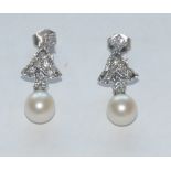 A pair of diamond and cultured pearl drop earrings,