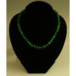 A jadeite globular bead necklace, diamond and seed pearl clasp,42cm long,