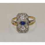 An Art Deco diamond and sapphire shield cluster ring, central oval blue sapphire approx 0.