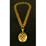 A Victorian yellow metal locket pendant necklace,