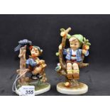 2 GOEBEL HUMMEL FIGURINES - BOY IN APPLE TREE WITH BIRD AND BOY ON FENCE WITH BIRD,