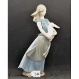 NAO FIGURINE COUNTRY GIRL HOLDING RABBIT (APPROX 27CM),