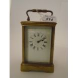 A BRASS CARRIAGE CLOCK WITH WHITE ENAMELLED DIAL,