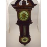 A JUNGHANS WOOD FRAMED WALL BAROMETER WITH THERMOMETER AND CLOCK