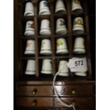 16 CHINA THIMBLES IN MINI DRESSER