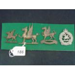 MILITARY CAP BADGES INCL 1ST MONMOUTSHIRE REGIMENT (1908-22) (LUGS),