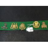 MILITARY CAP BADGES INCL LIVERPOOL PALS (REPAIRED?), LEEDS PALS (LUGS), 14TH IRISH RIFLES (LUGS),