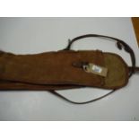 A BROWN CANVAS GUN SLING