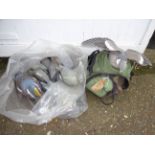 27 VARIOUS PIGEON DECOYS AND A BAG OF CAMO NETS