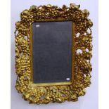 Ornate grape gilt framed mirror