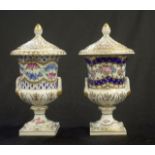 Two Dresden floral & gilt lidded urns