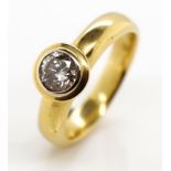 Diamond solitaire and 18ct yellow gold ring