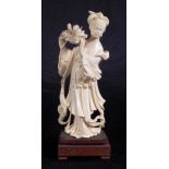 Vintage Chinese carved ivory figure with flowers