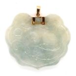 A oriental carved jade pendant and 14ct gold