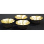 Four Chinese brass ceremonial tea cups