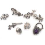 A group of silver charms and clasps