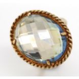 Silver gilt and blue stone ring