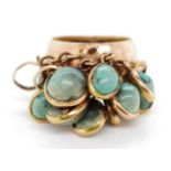 Egyptian gold ring set with green gemstones