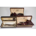 Three cased Dunhill pipes