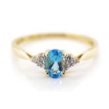 14ct yellow gold, blue topaz and diamond ring