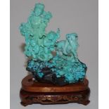 Chinese turquoise coloured figures group on stand