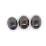 Three loose black opal cabochons