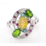 Opal and green garnet set silver ring