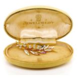 Jewel crest brooch