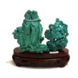 Chinese turquoise coloured figure on wood stand