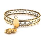 Gold bangle and hanging charm