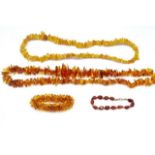 A group of amber beaded necklaces and bracelets