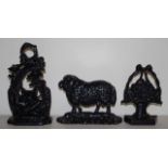 Three old cast iron doorstops