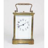 French brass carriage striking repeater clock.